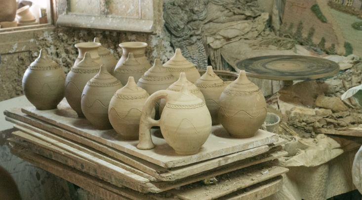 Handmade clay pottery pieces drying at a pottery studio in Shillong