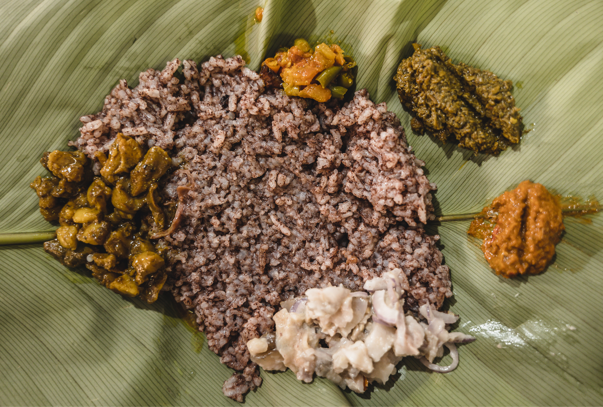 A spread of Khasi food including jadoh and local preparations