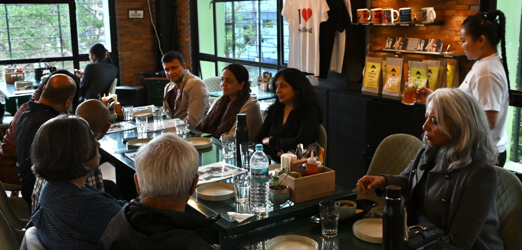 Friends gathered for a warm meal together at a Shillong cafe