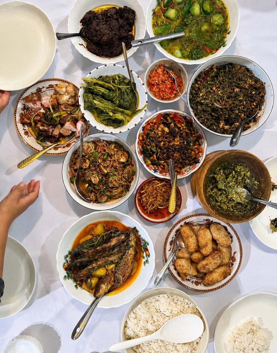 Table spread with many small Mizo dishes seen from above