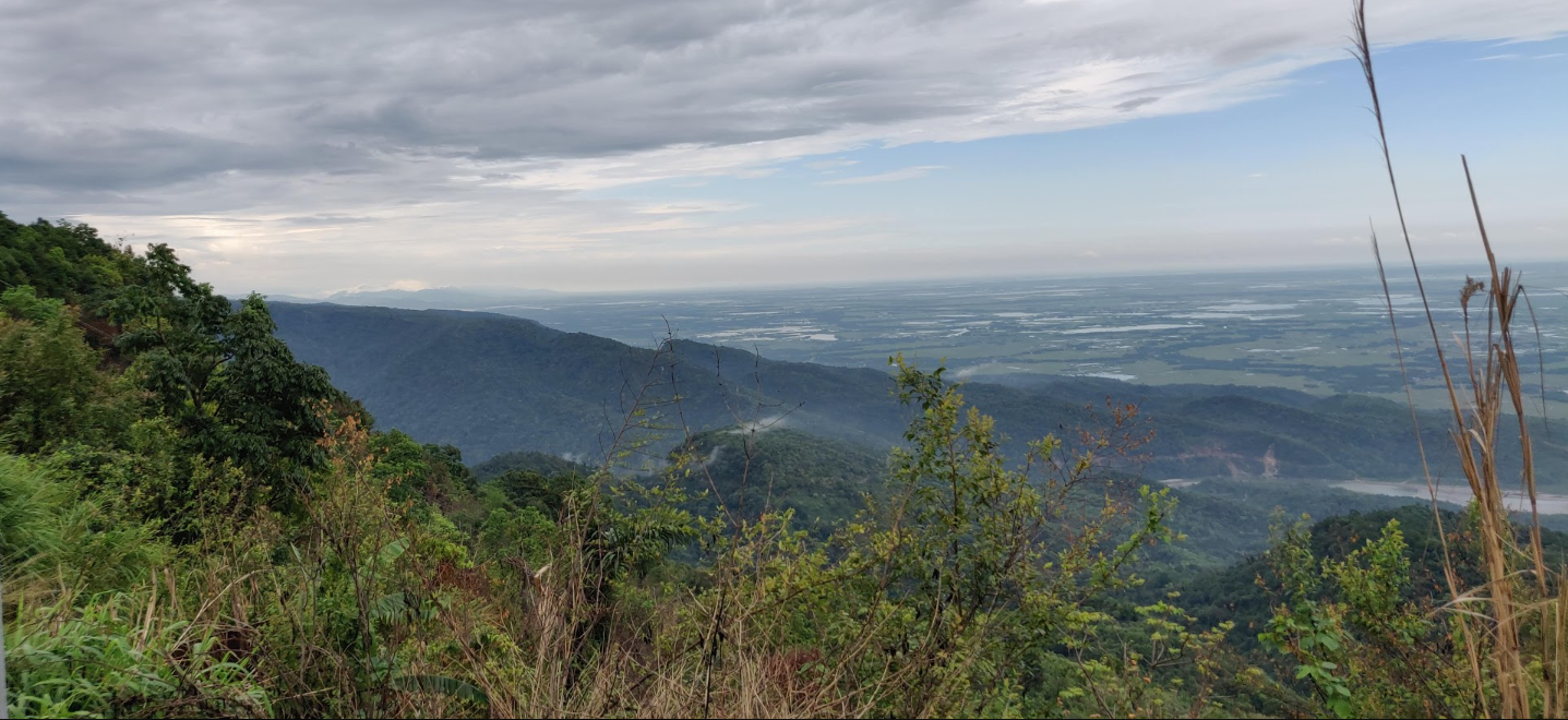 Hilltop view over green valleys and plains in Northeast India
