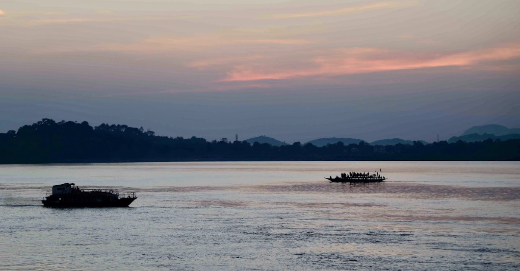 Boats on the Brahmaputra at sunset near Guwahati