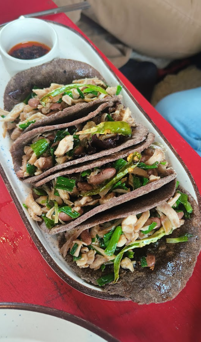 Local flatbreads topped with greens and chilli in Dirang